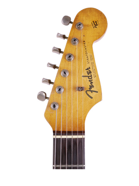 1964 Fender L Series Stratocaster in striking Fiesta Red, exemplifying vintage electric guitar elegance and American craftsmanship.