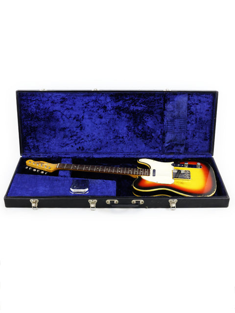 1966 Fender Custom Telecaster guitar nestled in a case, elegantly draped with blue velvet fabric.