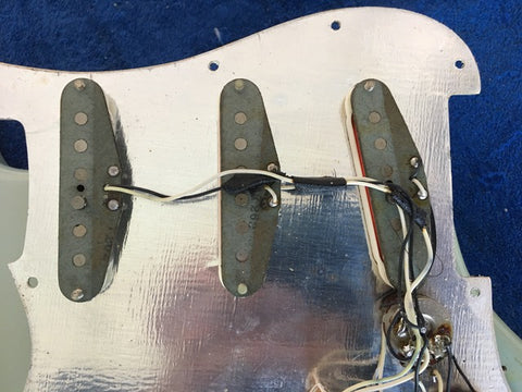 1972 Fender Stratocaster guitar with four pickups, highlighting its vintage refinished look. SOLD.