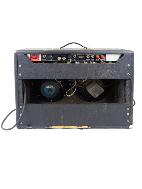 1977 Fender Vibrolux Reverb Amp in Silverface, featuring a speaker and microphone, perfect for live performances.