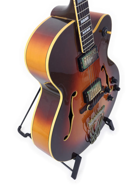1982 Yamaha AE1200 guitar, featuring a stunning brown body and a bold black headstock, a true gem for any musician.
