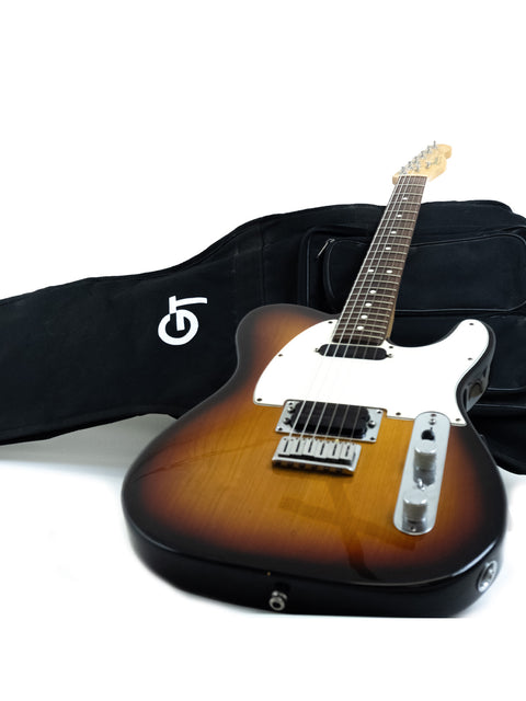 1991 Fender Telecaster Plus v.1 guitar with a protective case and strap, highlighting its vintage appeal.
