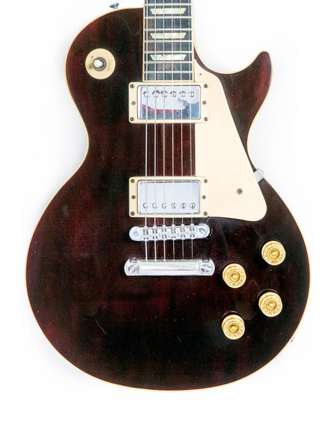 1991 Gibson Les Paul Standard electric guitar in brown, prominently displayed on a white background, highlighting its elegance.