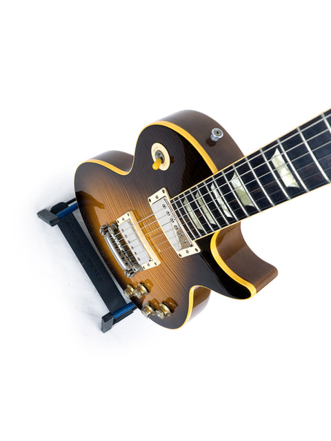 1993 Gibson Les Paul guitar, characterized by its brown body and yellow neck, representing a timeless musical instrument.