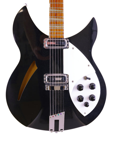 1996 USA Rickenbacker 360 WB electric guitar in black with a white pickguard, emphasizing its stylish and iconic design.