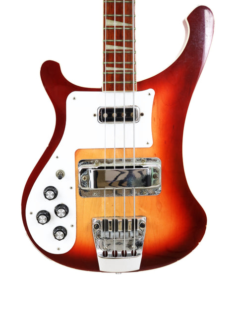 1997 Rickenbacker 4003 Fireglo Bass LH with a sleek white body and bold red headstock design.

