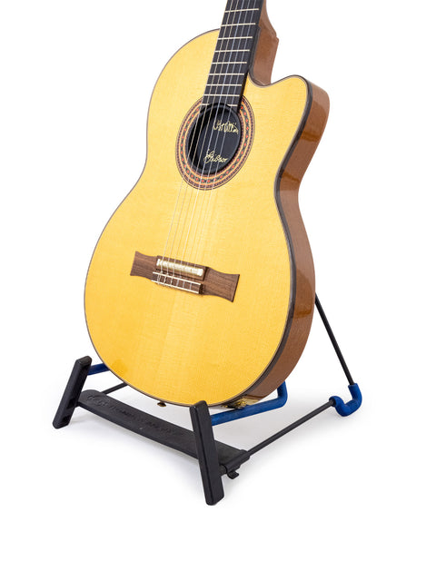 2001 Gibson Chet Atkins CEC Classical Electric Guitar displayed on a stand, set against a simple white backdrop.