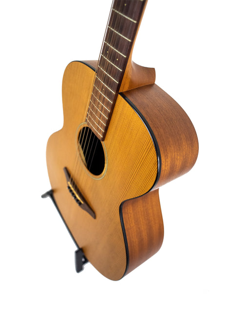 2008 Furch S40-CM guitar rests on a white background, showcasing its craftsmanship and sleek appearance.
