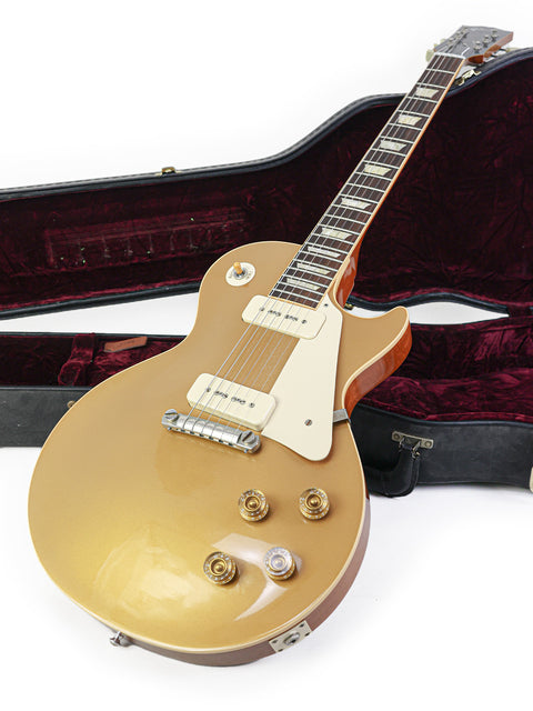 2011 Gibson Les Paul LPR-4 guitar in gold, resting in its case on a bright white background.