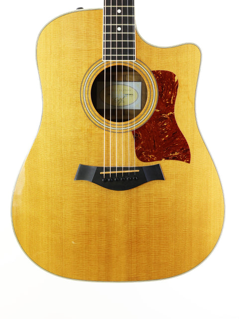 2011 Taylor 410CE grand acoustic guitar, featuring a beautiful finish and rich sound quality.