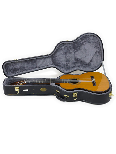 Inside a guitar case rests a 2021 Francisco Esteve 9C/B Classical guitar, showcasing its elegant design.