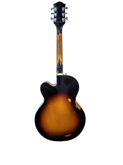 A 1964 Gretsch Double Anniversary 6117 guitar with a striking sunburst finish on a clean white background.