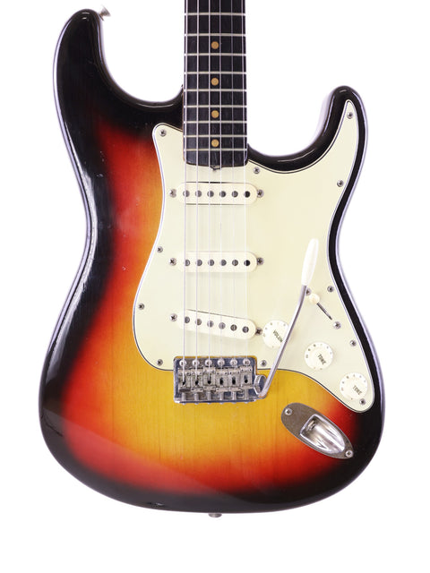 A 1964 Vintage Fender L Series Stratocaster with a striking sunburst finish, exemplifying timeless craftsmanship.