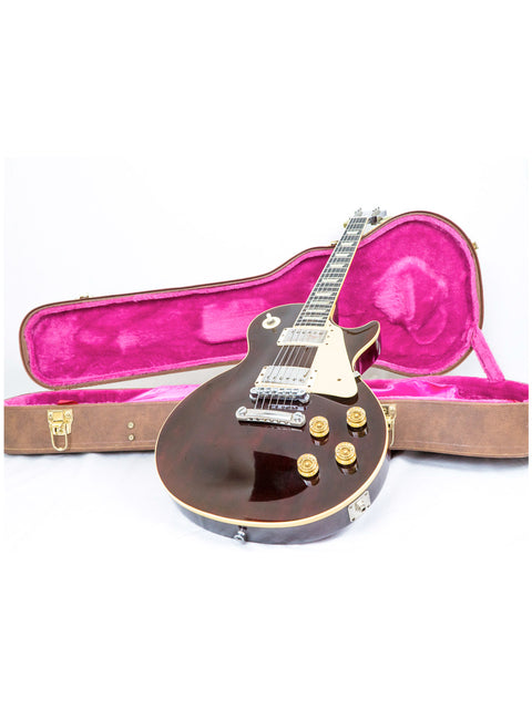 A 1991 Gibson Les Paul Standard guitar in brown, displayed in its case on a bright white background.
