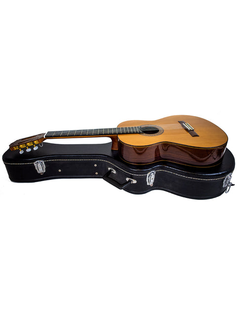 A 2005 Alhambra C-Series ORO classical guitar nestled in its case, showcased on a bright white background.