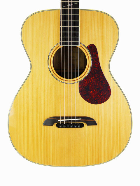 A 2008 Alvarez Yairi FYM95V acoustic guitar set against a pristine white backdrop, showcasing its elegant design.