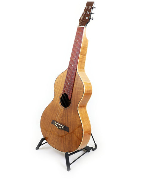 A 2014 Gilet WB (Weissenborn Style) guitar with a wooden body displayed on a stand.