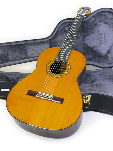 A 2021 Francisco Esteve 9C/B classical guitar in a protective case, displayed on a bright white background.