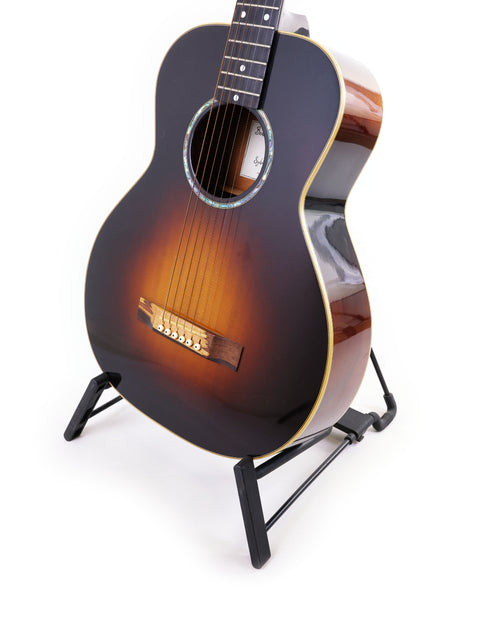 A Beau Hannam Parlour guitar from Australia 2009 displayed on a stand against a clean white background.