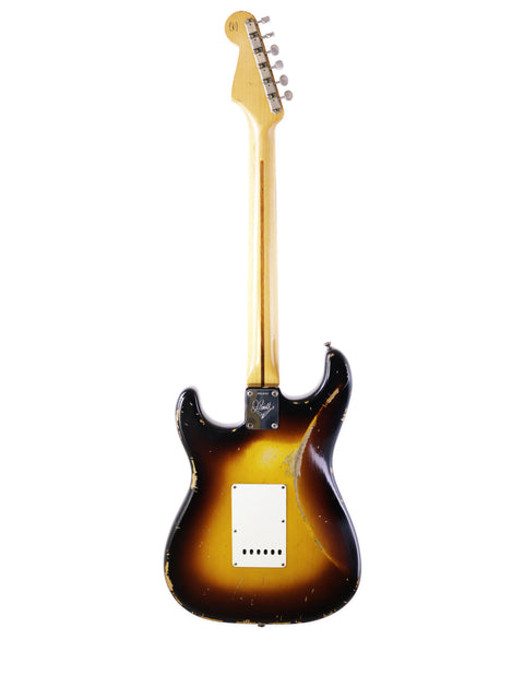 A Fender Jason Smith Masterbuilt Stratocaster '57 Reissue guitar with a brown body and black headstock, USA 2015 model.