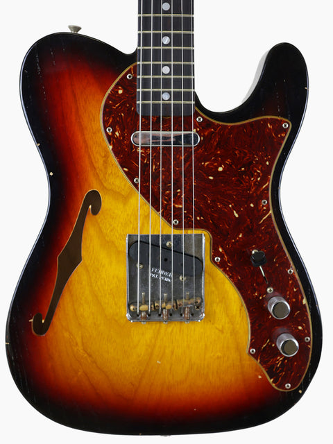 A Fender Limited Edition ’60s Telecaster Thinline Journeyman Relic guitar with a striking sunburst finish.