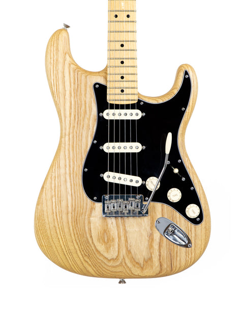 A Fender Limited Edition Stratocaster guitar in natural oiled ash, set against a clean white background.