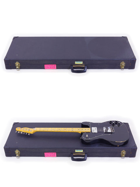 A Fender Telecaster Custom 1978 and another guitar in a case, displayed on a white surface.