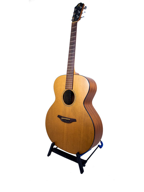 A Furch S40-CM guitar from 2008 displayed on a stand against a clean white background.