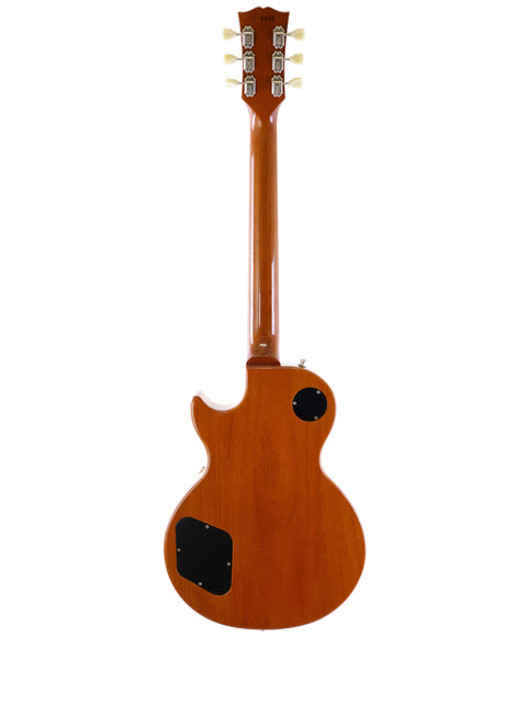 A Gibson Les Paul Classic 1960 Reissue guitar, distinguished by its rich wooden body and neck, representing timeless craftsmanship.