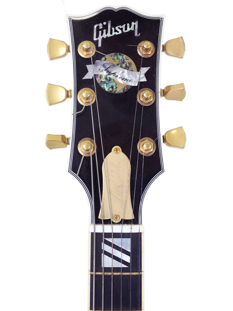 A Gibson Les Paul Custom Shop guitar, model Supreme, from the USA, crafted in 2003, showcasing its elegant design and craftsmanship.
