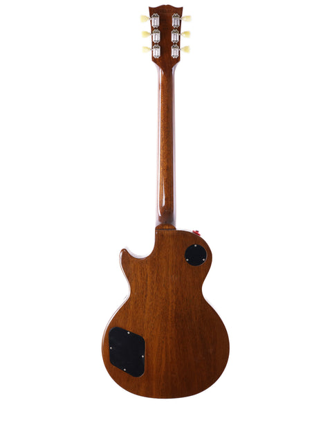A Gibson Les Paul Traditional guitar with a wooden body and neck, showcasing its classic design from the USA, 2013 model.
