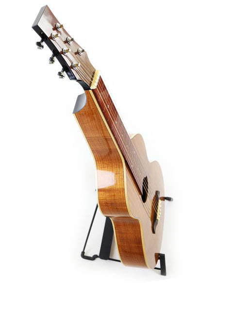  A Gilet WB Weissenborn-style guitar is displayed on a stand, set against a simple white backdrop, highlighting its craftsmanship.