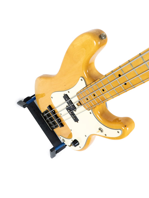 A Greco PB 750 Electric Bass, made in Japan between 1971-75, prominently featured on a white backdrop.