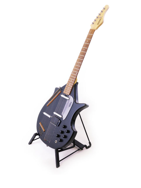 A Jerry Jones Master Electric Sitar elegantly positioned on a stand, set against a minimalist white backdrop.