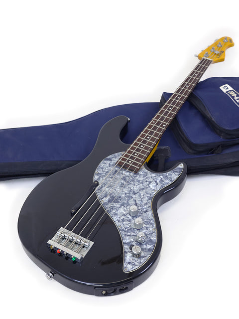 A Line 6 Variax Bass guitar (2004) resting in its case and bag, emphasizing its modern design and travel-friendly accessories.