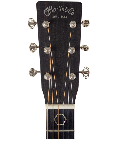 A Martin DC Aura GT Dreadnought acoustic guitar from 2019, showcasing its elegant design and rich wood finish.