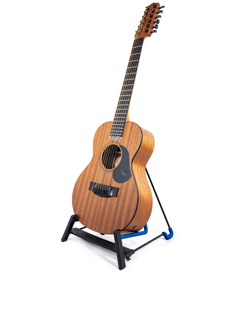 A Maton Mahogany Mini12 String guitar with a blue handle, positioned on a stand, ready for play.