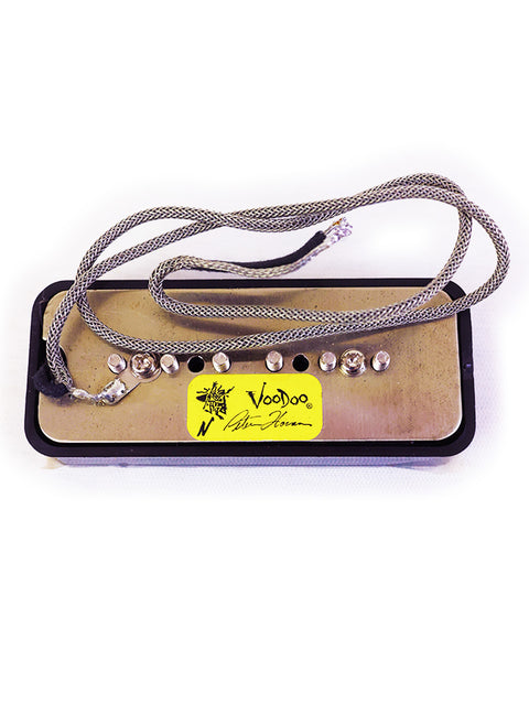 A Peter Florance Voodoo P90 guitar pickup with a cable attached, showcasing its sleek design and craftsmanship.