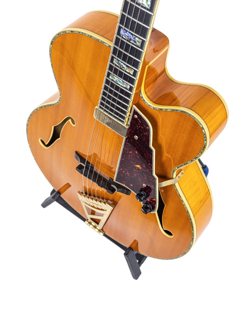 A beautifully crafted D’Angelico New Yorker Series Excel EXL-1DP guitar showcasing a wooden body and stylish black pick guard, 2008.