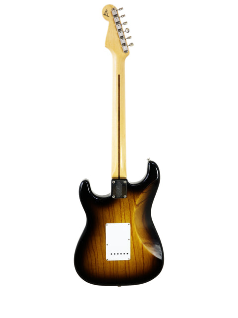 A black-bodied Fender Custom Shop ‘54 Stratocaster with a brown neck, celebrating its 50th Anniversary, USA 2004.