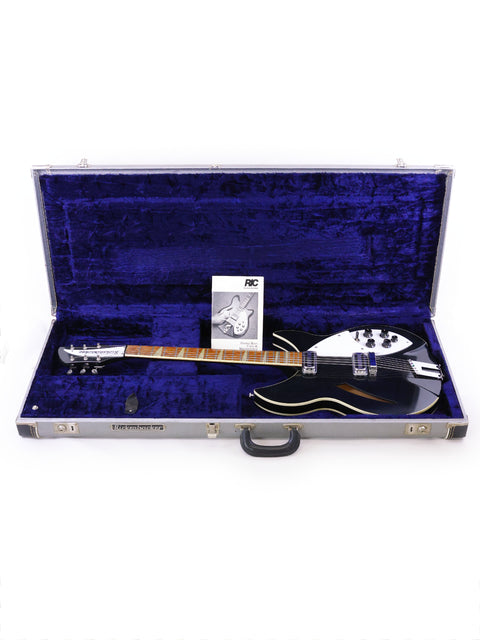 A black and silver Rickenbacker 360 WB guitar, USA-made in 1996, housed in a protective case.