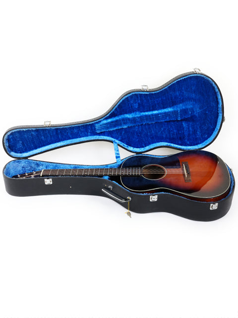 A blue-covered guitar case featuring a K. Yairi G-1F acoustic guitar from Japan, 2005, ready for performance.