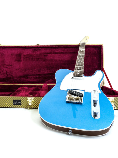 A blue electric guitar stored in a case, featuring Txxx Custom Style Partscaster, Pelham Blue, USA, dated 2020/2021.
