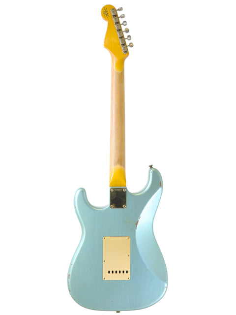 A blue electric guitar with yellow strings, showcasing the Fender Custom Shop Ltd Poblano Partscaster from the USA, 2020.
