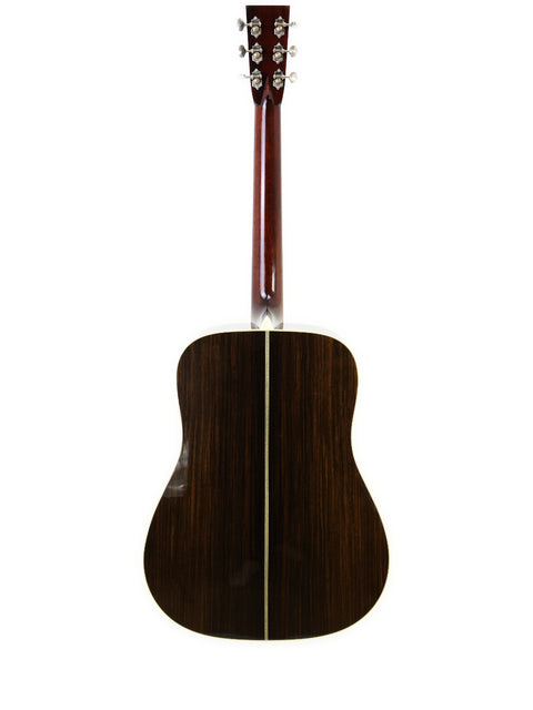 A brown Collings D2H acoustic guitar from 2006, elegantly displayed against a clean white background.
