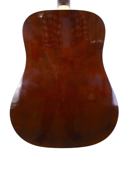 A brown Guild D40 guitar from 1989, set against a clean white background, showcasing its classic design.