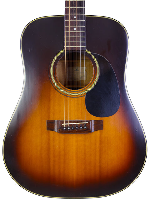 A brown and orange K. Yairi W1S guitar from Japan, 1983, featuring a sleek black pick guard.