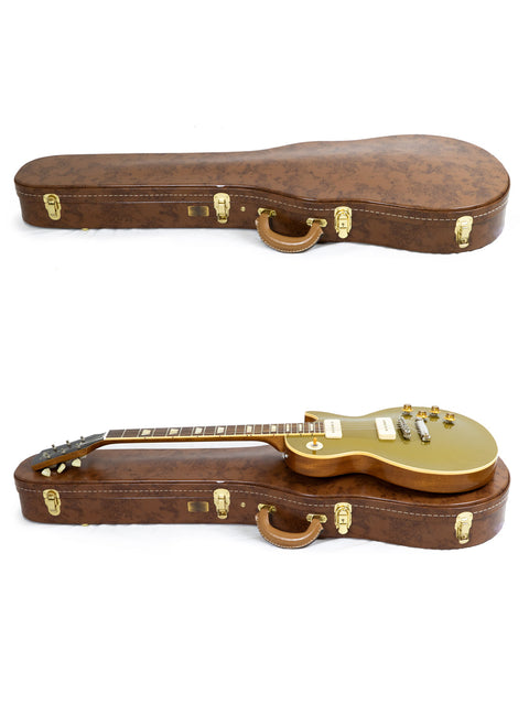 A case containing two guitars featuring gold hardware, highlighting the 2019 Gibson Custom Historic Limited Edition Goldtop.