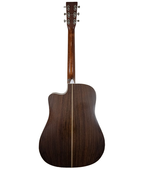 A close-up of the back of a Martin DC Aura GT Dreadnought guitar, featuring rich wood grain from the USA, made in 2019.