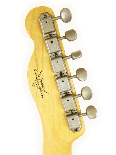 A close-up of the neck of a sunburst Txxx Custom Style Partscaster electric guitar from 2021, highlighting its unique features.

